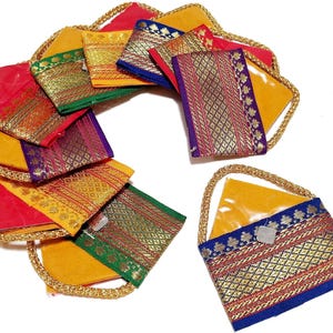 May include: A collection of small, rectangular fabric pouches with gold braided handles. Each pouch features vibrant colors including red, yellow, green, and blue, accented with intricate metallic gold woven patterns and decorative borders.