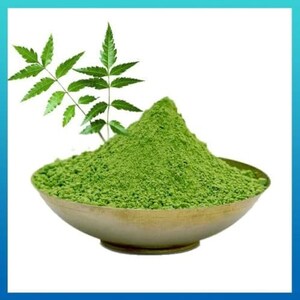 May include: A bowl of green neem powder with a neem leaf sprig on the side.