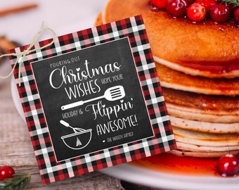 May include: A red and black buffalo check printable gift tag with a chalkboard background. The text on the tag reads "Pouring out Christmas Wishes Hope your Holiday is Flippin' Awesome! The Wilcox Family".