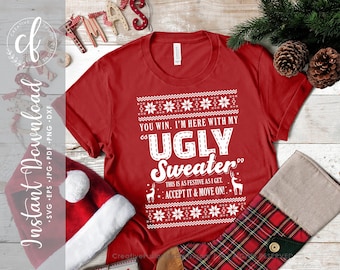 Op de afbeelding: Rode kersttrui met een wit ontwerp met de tekst "You win. I'm here with my ugly sweater. This is as festive as I get. Accept it & move on!"