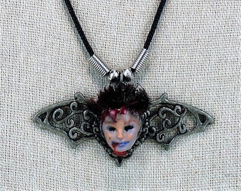 barbie head necklace