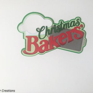 May include: Green, red, and gray paper cut-out design with the text "Christmas Bakers" and a chef's hat.