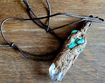Turquoise encased pendant with quartz crystal