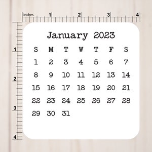 May include: A white calendar with the month of January 2023 printed on it. The calendar shows the days of the week, Sunday through Saturday, and the dates for each day of the month.