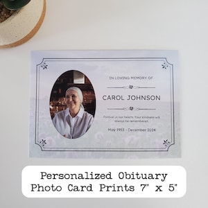 May include: A white card with a black border and a photo of a woman in a white shirt. The text "IN LOVING MEMORY OF CAROL JOHNSON" is printed in black at the top of the card. The text "Forever in our hearts. Your kindness will always be remembered. May 1953 - December 2024" is printed in black below the photo. The text "Personalized Obituary Photo Card Prints 7" x 5" is printed in black at the bottom of the card.