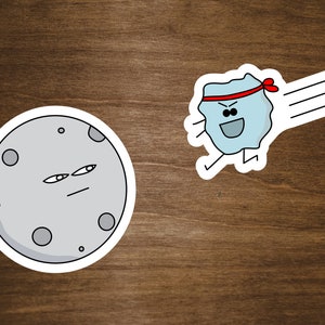 May include: A cartoon moon with a serious expression is being punched by a cartoon rock wearing a red headband. The rock is flying through the air with a trail of motion lines behind it.