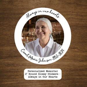 May include: A white circle sticker with a photo of a woman and the text "Always in our hearts Carol Marie Johnson 1953-2024". Below the circle is a white rectangle with the text "Personalized Memorial 2" Round Glossy Stickers - Always in Our Hearts".