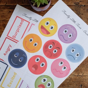 May include: A printable sheet with the words "Friendly Little Faces - Emotions" at the top.  There are nine colorful circles with different facial expressions, including happy, sad, angry, surprised, and excited.  Each circle has a different color, including yellow, orange, red, purple, blue, pink, and green.