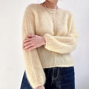 May include: A set of three ceramic mugs with a speckled, matte finish. The mugs are in shades of cream, light gray, and dark gray. Each mug has a simple, minimalist design, perfect for coffee or tea.