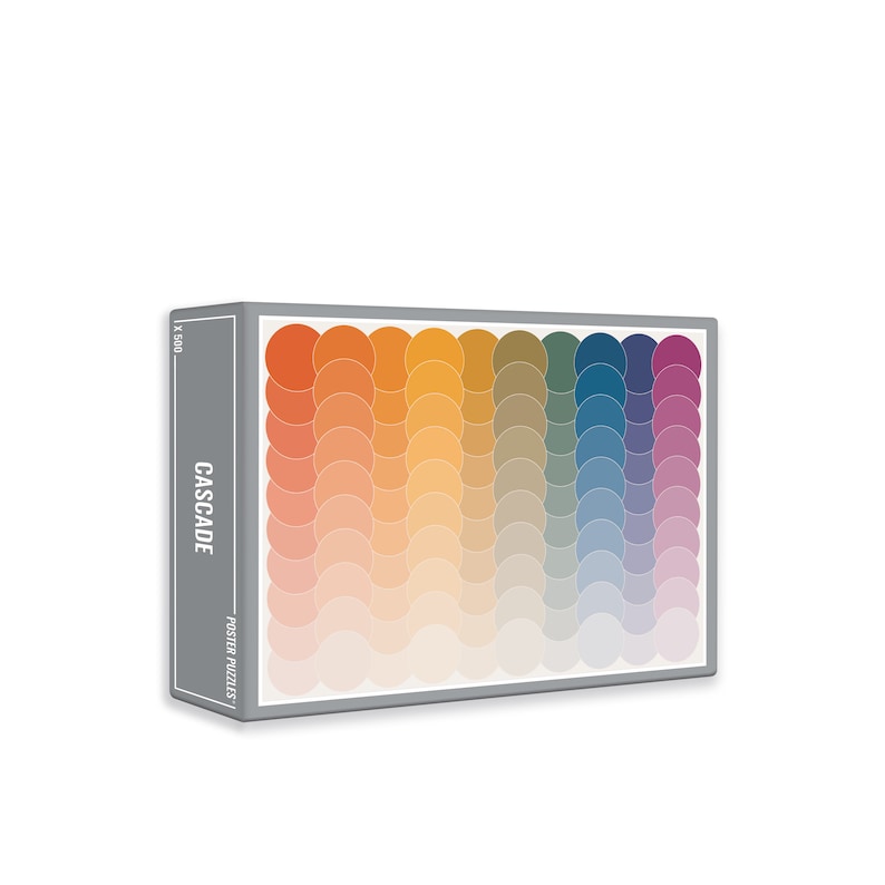 May include: A box for a 500 piece jigsaw puzzle with a colorful abstract design of overlapping circles in shades of orange, yellow, green, blue, and purple. The box is labeled "CASCADE POSTER PUZZLES".