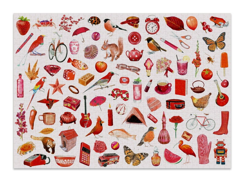 May include: A completed jigsaw puzzle with a collage of watercolour illustrations in red, orange, and pink. The puzzle features images of a strawberry, birds, a bicycle, a guitar, and a robot.