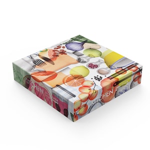 May include: A colorful box with a white background and a variety of kitchen ingredients, including fruits, vegetables, spices, and kitchen tools. The box has the text "Kitchen" printed on it.
