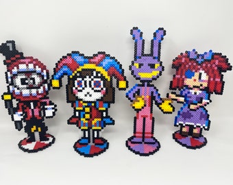 May include: Four pixel art figures made of colorful beads. The figures are a jester with a red and blue hat, a jester with a red and blue hat, a purple bunny with yellow overalls, and a girl with red hair and a purple dress.