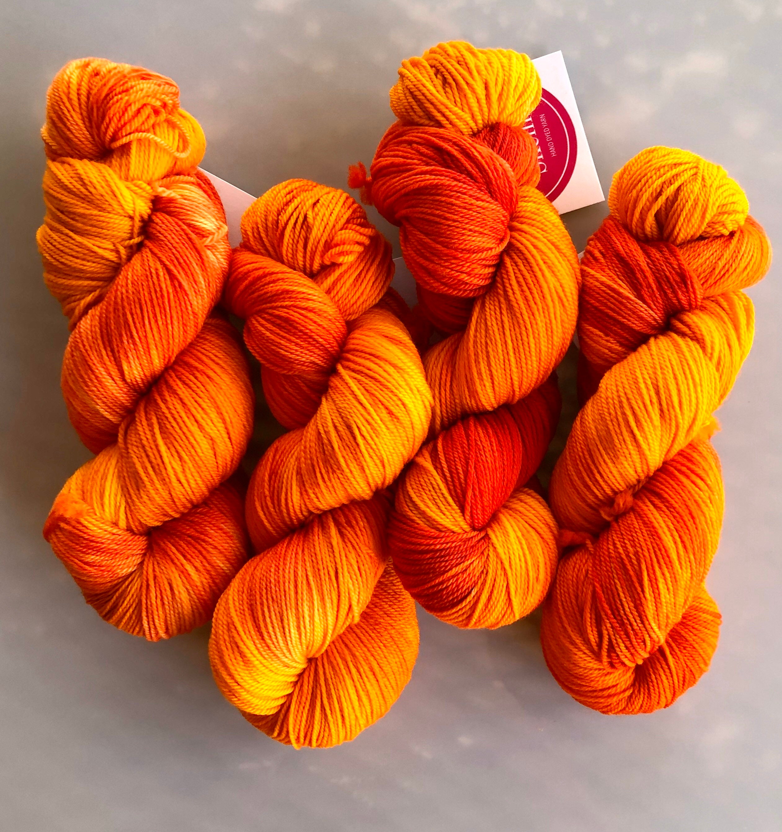 Tangerine hand dyed sport weight yarn on superwash merino ...