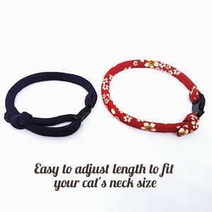 May include: Two adjustable cat collars, one red with white flowers and one dark blue.  "Easy to adjust length to fit your cat's neck size" is written below the collars.
