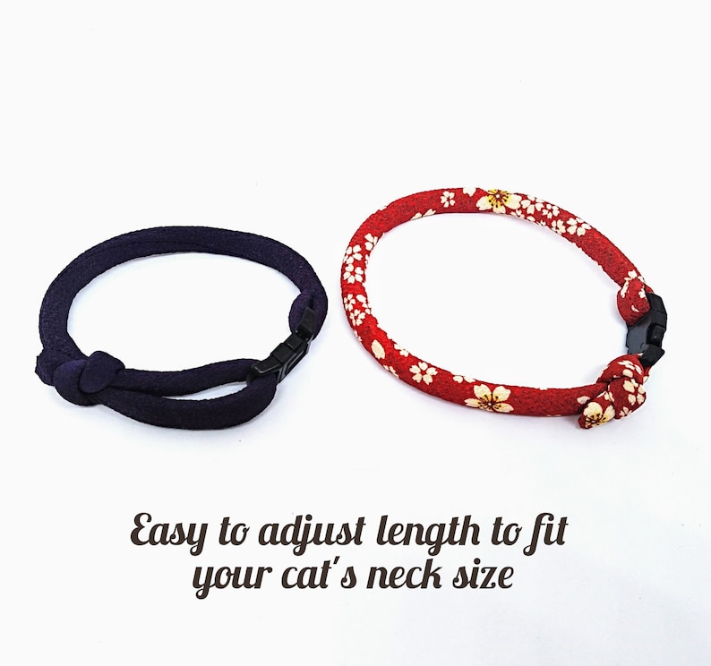 May include: Two adjustable cat collars, one red with white flowers and one dark blue.  "Easy to adjust length to fit your cat's neck size" is written below the collars.