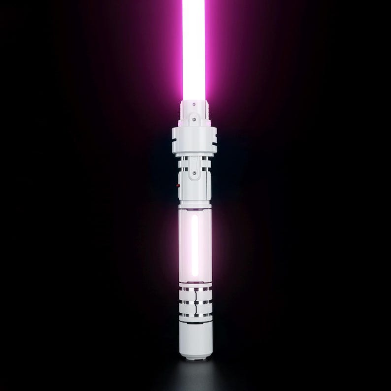 May include: A white lightsaber with a pink blade. The lightsaber has a black handle with silver accents.