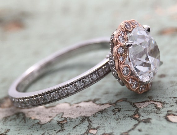 Two Tone Halo Ring Featuring an 8mm Winfields OEC Cubic Zirconia