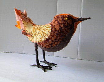 Textile art bird soft sculpture.