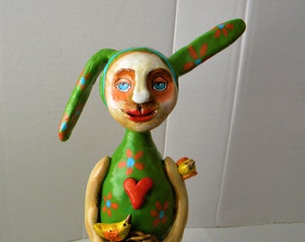 Whimsical bunny clay sculpture