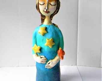 Whimsical star girl clay sculpture