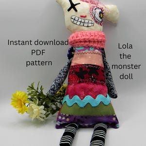 May include: A handmade rag doll with a stitched-on face, pink yarn hair, and a multi-colored patchwork dress. The doll is labeled "Lola the monster doll".