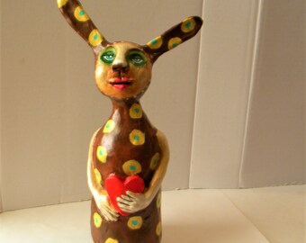 Whimsical bunny clay sculpture