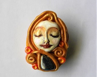 Whimsical clay brooch with hematite
