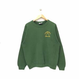 May include: A green sweatshirt with the words "Lancaster County Corrections" in yellow lettering. The sweatshirt is hanging on a wooden hanger against a white background. The sweatshirt has a crew neck and long sleeves.