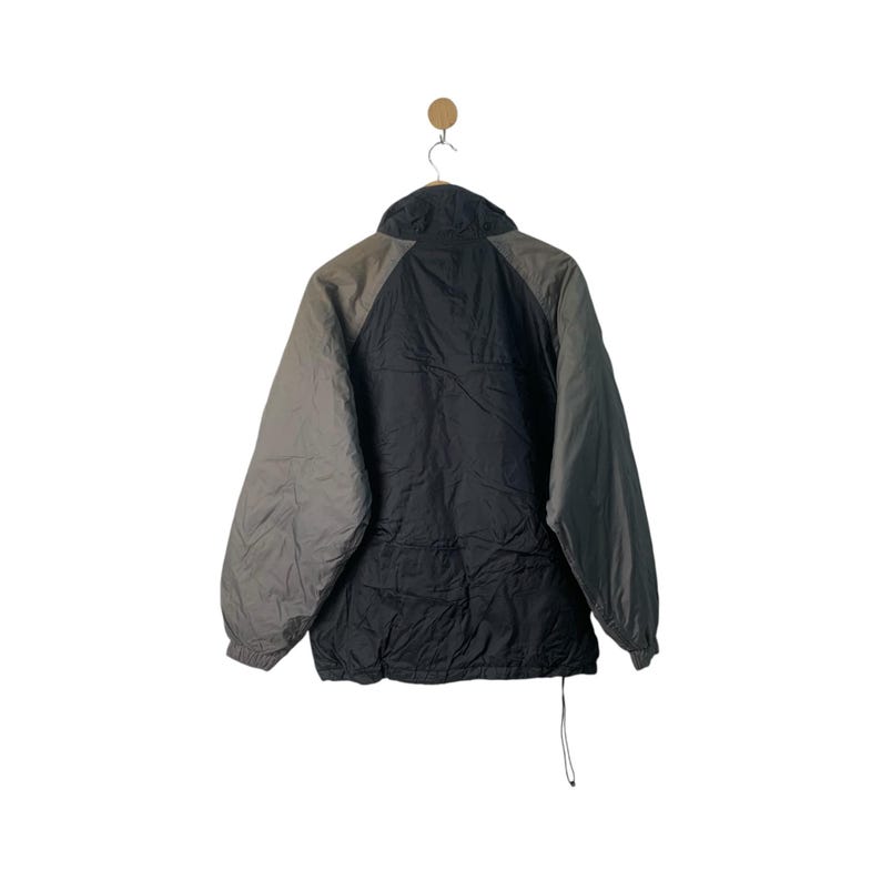 May include: A black and gray color block jacket with a zipper closure. The jacket has a stand-up collar and a drawstring at the bottom.