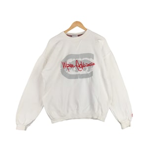 May include: White sweatshirt with a red and grey logo that says "Marc Ecko 2002".