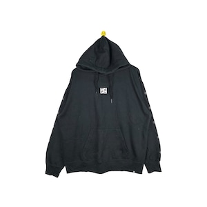 May include: Black hooded sweatshirt with a small white square logo on the front and a white star pattern on the sleeves.