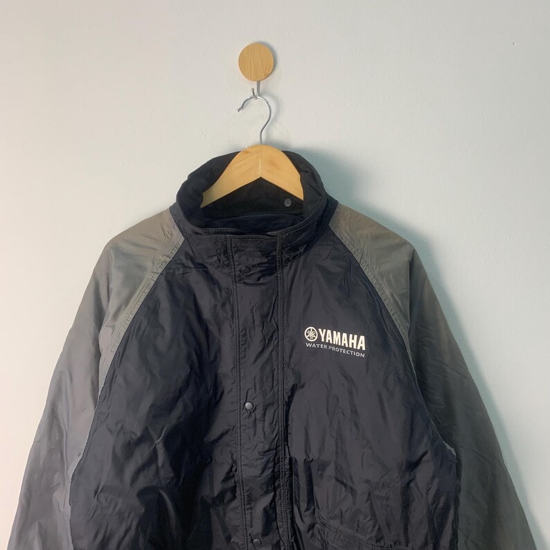 May include: Black and gray jacket with a Yamaha logo and the words "Water Protection".