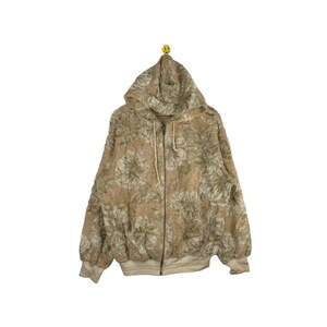 May include: A beige hooded sweatshirt with a floral pattern. The zipper is closed and the hood is up.
