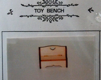 Dollhouse miniature kit in twelfth scale or 1:12 scale.  Toy Bench by Pixi Miniatures.  Item #D675.