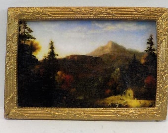 Dollhouse miniature accessory in twelfth scale or 1:12 scale. Mountain scene print in gold frame.   Item #N297.