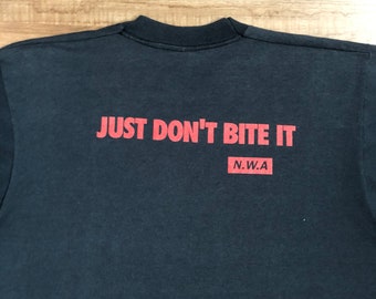 Mega Rare Vintage 90’s N.W.A Shirt Nwa Eazy E / Screen Stars / Just Don't Bite It / Hip Hop / Rap Tees / Flavor Flav / Chuck D / DJ Lord Mega Rare Vintage 90’s N.W.A Shirt Nwa Eazy E / Screen Stars / Just Don't Bite It / Hip Hop / Rap Tees / Flavor Flav / Chuck D / DJ Lord