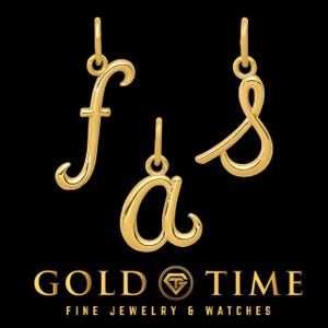 May include: Three gold-colored cursive letter charms, 'f', 'a', and 's', on a black background. The charms are for jewelry making and are sold by Gold Time Fine Jewelry & Watches.