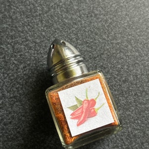 1/2 Ounce Pure Guam Boonie Pepper Powder in a table salt shaker, spice up mealtime island-style