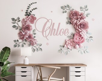 May include: A pink and green paper flower wall decor with the name "Chloe" in pink lettering.