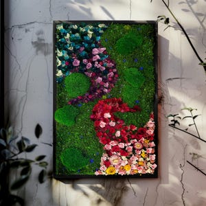 Handmade preserved moss wall art with LED fiber optic firefly lights, featuring vibrant real moss and dried flowers like hydrangeas in a customizable frame (black, white, wood, walnut). This no-maintenance, eco-friendly living wall decor enhances any space with nature’s beauty. Available in multiple sizes, perfect for homes, offices, or as a unique gift. Adds tranquility and organic elegance with lush, colorful moss and soft illumination