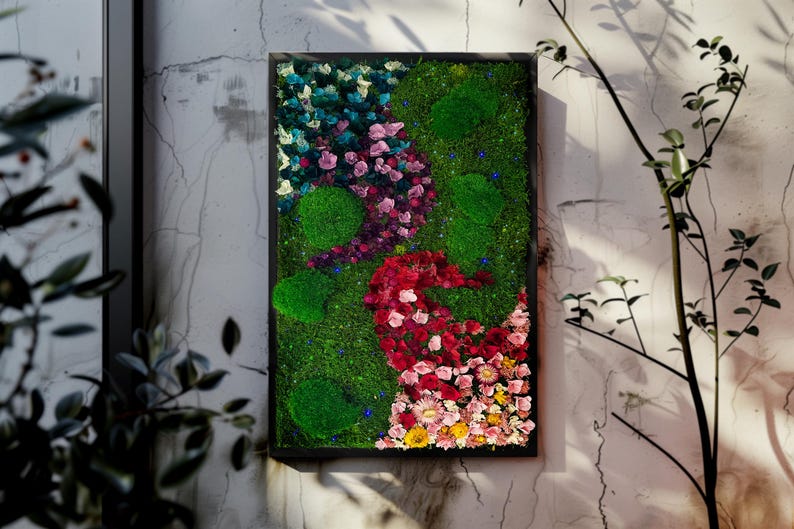 Handmade preserved moss wall art with LED fiber optic firefly lights, featuring vibrant real moss and dried flowers like hydrangeas in a customizable frame (black, white, wood, walnut). This no-maintenance, eco-friendly living wall decor enhances any space with nature’s beauty. Available in multiple sizes, perfect for homes, offices, or as a unique gift. Adds tranquility and organic elegance with lush, colorful moss and soft illumination