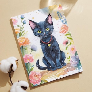 May include: A black cat with a red collar and a heart-shaped tag sits on a log surrounded by watercolor flowers. The cat has green eyes and a white patch on its chest.