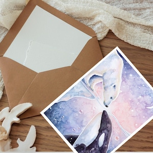 May include: A watercolour art print depicting a polar bear and an orca whale against a soft, dreamy backdrop. The print is on a white card, with a brown envelope. The artwork has a whimsical, nature-inspired theme.
