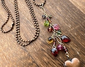 Gemstone and copper locket necklace, warm color palette, whimsical beauty