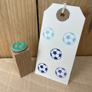 De zegel van de voetbal, de stempel van het voetbalrubber, mini voetbalzegel