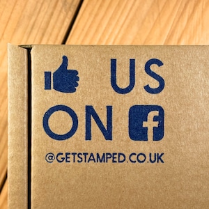 May include: A brown cardboard box with the text "US ON" and a Facebook logo, along with the text "@GETSTAMPED.CO.UK".