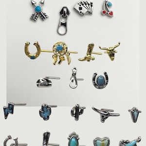 May include: A collection of silver-toned and gold-toned earrings with various designs, including arrows, playing cards, a zipper, a horseshoe, a dreamcatcher, a cowboy boot, a bull's head, a lightning bolt, a cactus, and a horse.