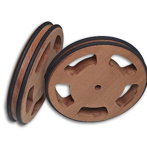 May include: Two wooden spools with black rubber edging. The spools have a circular shape with five evenly spaced cutouts around the center hole.