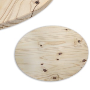 May include: Two light-colored wooden circles with visible wood grain and knots. One circle is complete, while the other is partially visible, showing a curved edge with grooves. The wood has a natural, unfinished appearance.
